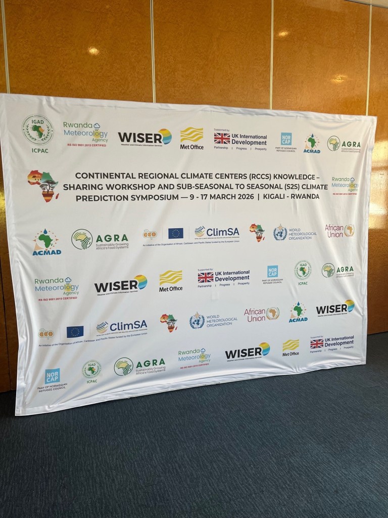 A banner showing a range of logos for institutions involved at the workshop and symposium.